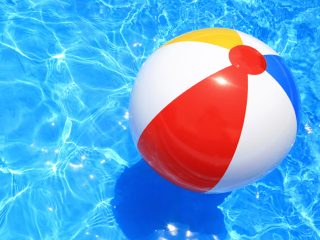 Beach ball floating in a pool